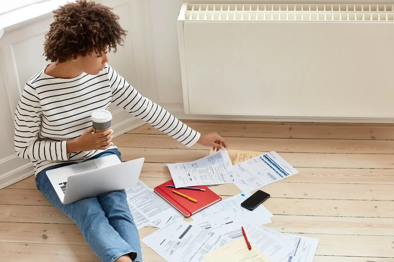 young, busy businesswoman working at home